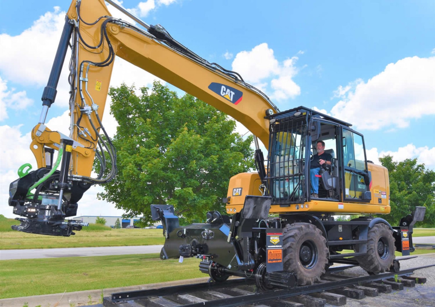 wheeled-excavator-rail-gear-mitchell-railgear